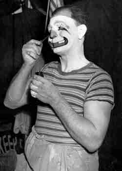 Felix Adler putting on makeup